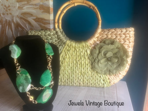 Woven Green Tote includes a floral brooch and wooden handle